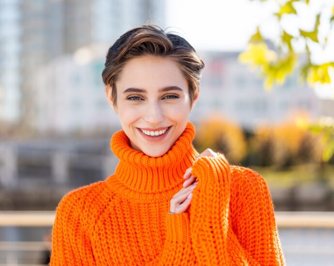 Beautiful young woman with short hair in the city