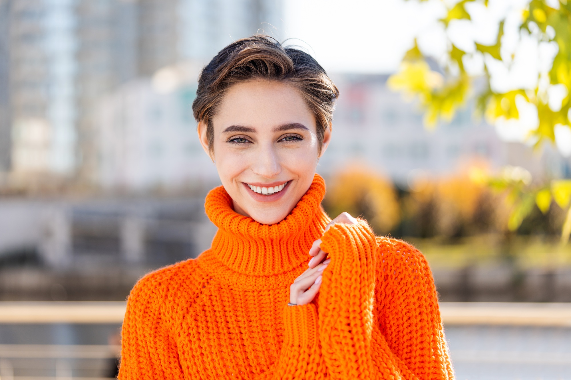 Beautiful young woman with short hair in the city